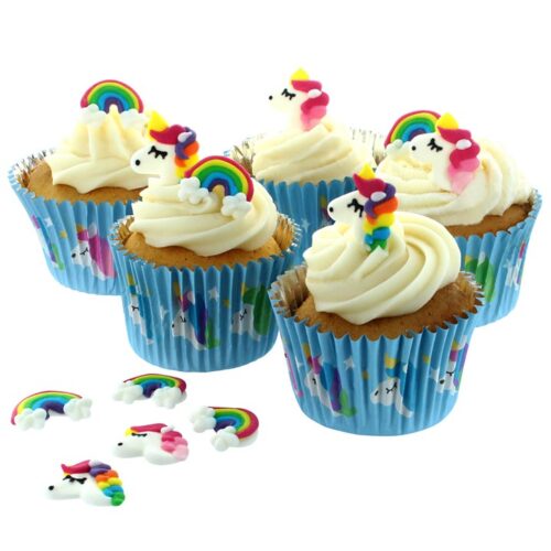 unicorn and rainbow sugar decorations pictured on cupcakes