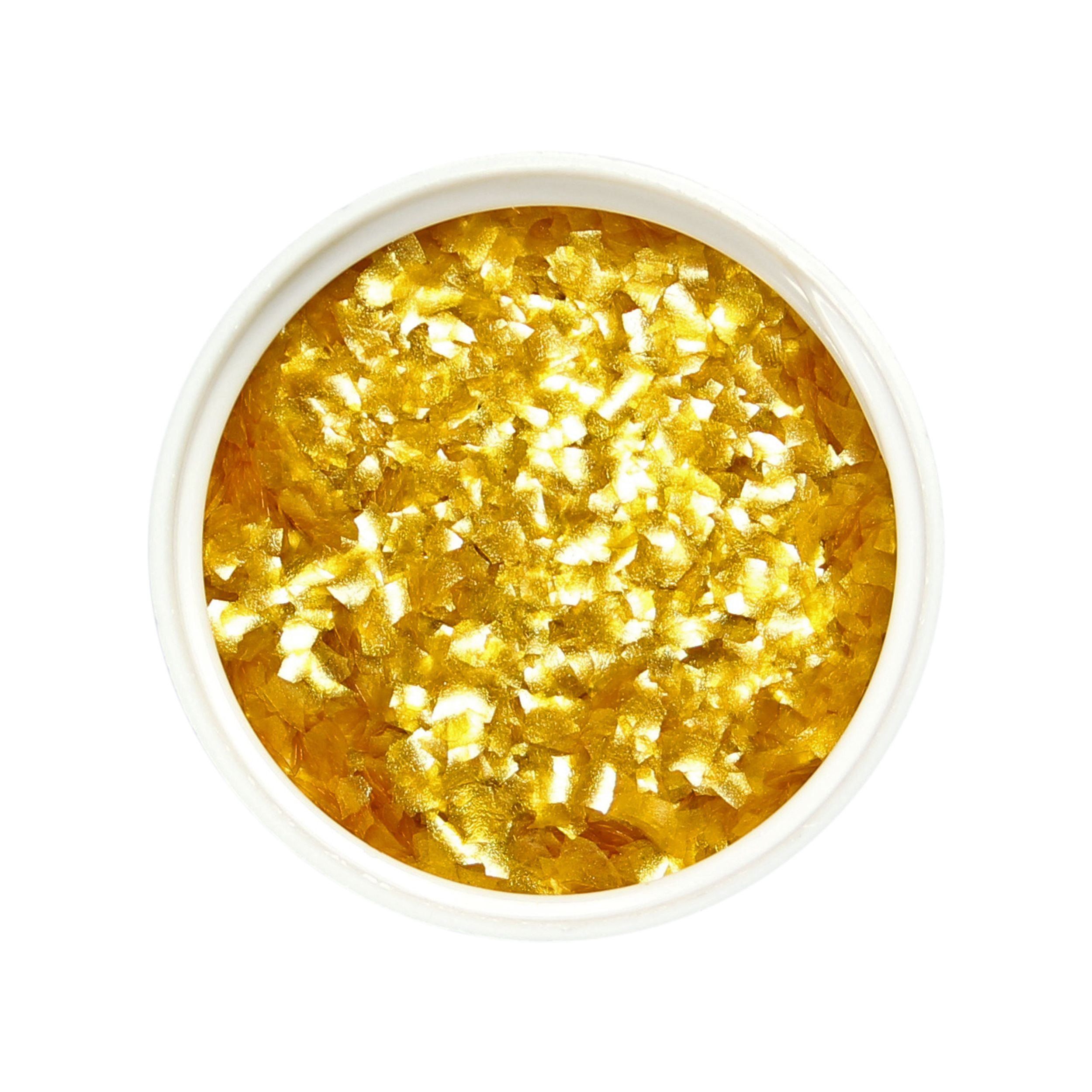 Edible glitter flakes gold close up