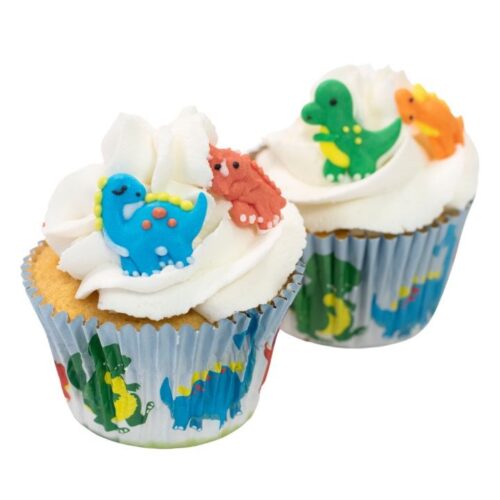 dinosaur sugar decorations pictured on cupcakes
